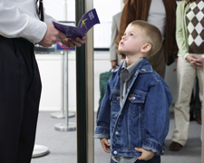 Photo of a young boy with a boarding pass