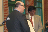 USCIS Director Emilio T. González presents Dr. Kiran Patel with the “Outstanding American by Choice” recognition in Tampa, FL, Dec. 14, 2006