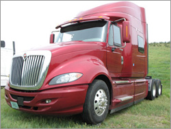 Photo of a red International ProStar truck.