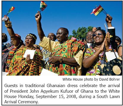 Guests in traditional Ghanaian dress celebrate the arrival of President John Agyekum Kufuor of Ghana to the White House Monday, September 15, 2008, during a South Lawn Arrival Ceremony.