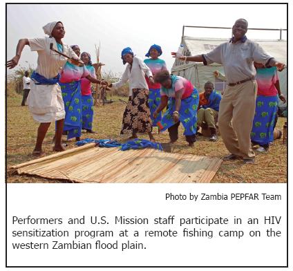 Performers and U.S. Mission staff participate in an HIV sensitization program at a remote fishing camp on the western Zambian flood plain.
