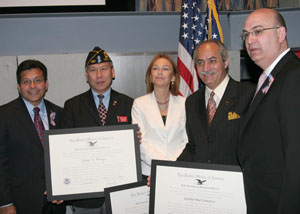 During the U.S.S. Intrepid ceremony USCIS Director Gonzalez and U.S. Attorney General, Alberto Gonzales presented Fang A. Wong, Dr. Guillermo Linares, and Marina Belotserkovsky with the "Outstanding American by Choice" certificates.