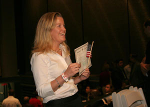 New U.S. citizen proudly displays her certificate of citizenship.