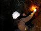 Photo of a  researcher collecting a sample at a mine for microbial analysis.