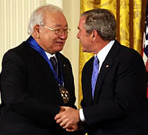 President Bush shaking hands with Scott Momaday.