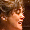 CLose up profile of a female singer in performance