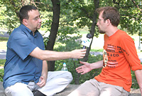 Reporter interviewing young man 