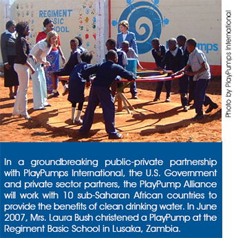 In a groundbreaking public-private partnership with PlayPumps International, the U.S. Government and private sector partners, the PlayPump Alliance will work with 10 sub-Saharan African countries to provide the benefits of clean drinking water. In June 2007, Mrs. Laura Bush christened a PlayPump at the Regiment Basic School in Lusaka, Zambia. Photo by PlayPumps International