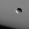 The Cassini spacecraft provides this dramatic portrait of Janus against the cloud-streaked backdrop of Saturn