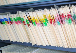 Photo of folders in a vertical file cabinet