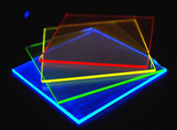 Photo of solar concentrators absorbing and reemiting different colors of light.