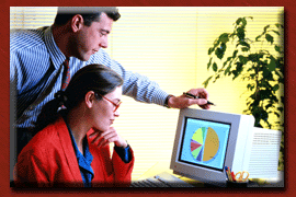 Two workers looking at computer screen