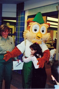 Picture of Woodsy Owm being hugged by a young student at Robenson Elementary Center, Birdsboro, PA