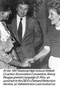 photo - At the 1987 National High School Athletic Coaches Association Convention, Nancy Reagan greeted Jacquelyn D. Rice, an assistant in the DEA's Demand Reduction Section, as Administrator Lawn looked on.