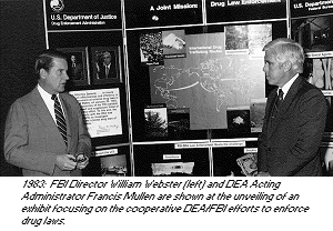 photo - 1983: FBI Director William Webster and DEA Acting Administrator Francis Mullen are shown at the unveilng of an exhibit focusing on the cooperative DEA and FBI efforts to enforce drug laws.