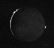 Io - crescent with plumes