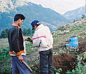 Photo shows Nepali workers and researchers setting up seismic stations.