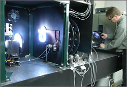 Researcher using spectral responsivity measurement system.