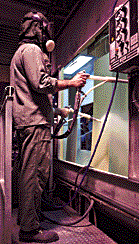 Man with filter mask working on machining