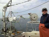 Brian Andrews with the Mini SEABOSS ready for deployment from the research vessel Rafael. 