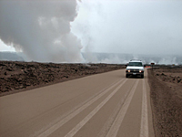 HVO vehicle leaves tracks in a thin layer of ash blanketing Crater Rim Drive after the April 16, 2008, explosion.