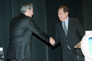 Secretary Gutierrez shakes hands with Congressional leader