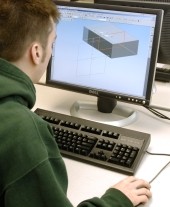 male student at computer with 3-D image on the monitor