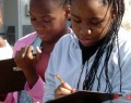 Photo of female students with notebooks