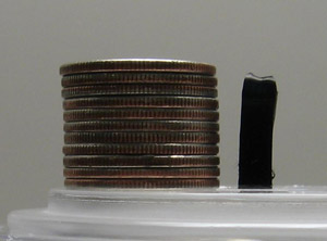 carbon nanotube next to a stack of 11 quarters