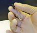 Hand holding new nanocomposite paper