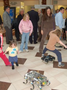 visitors enjoying the hexapod robots in the atrium