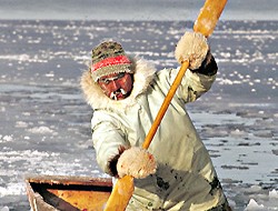 eskimo hunter in boat