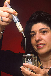 Photo: Chemist Sevim Z. Erhan examines soybean based polymer. Link to photo information