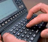 Photo: Person operating handheld device