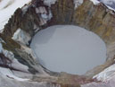 Picture looking down into volcano. Image links to additional information about volcanic lake drainage events.