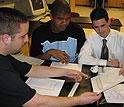 Photo of teacher Judson Wagner working on bridge designs with his physics students.