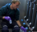 Photo of Maxime Grand, a PhD student at the University of Hawaii, taking seawater samples.