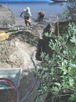 USGS scientists installing an experimental horizontal multilevel sampler to test its usefulness for monitoring the performance of the permeable reactive barrier's ability to remediate a phosphate plume discharging to Ashumet Pond, Cape Cod, MA