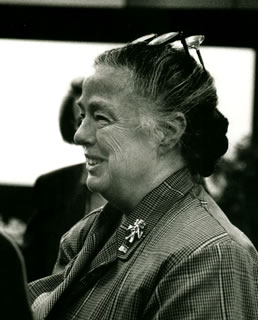 Photo of Bess Hawes from the side at an event		