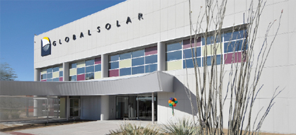 Photo of the exterior of a three-story building with lettering mounted on it that spells 'Global Solar.'