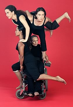   Dancers form a 'pyramid' atop a wheelchair				