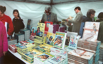 People browsing books in a tent		