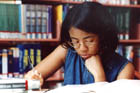 A girl studies her school work.