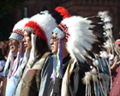American Indians in traditional costumes.