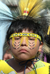 American Indian boy in traditional costume.