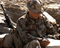 A soldier writes a letter during Operation Desert Storm in 1991.