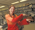 Photo of Elizabeth Harbron demonstrating the dance of conjugated polymers.