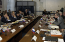 Ambassador Ushakov and Dr. Mazurenko (center left, center right) hearing Secretary Gutierrez' welcoming remarks