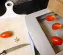 Photo showing slicing of tomatoes and analysis of their shapes by scanning.