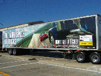 trailer emblazoned with TACT message